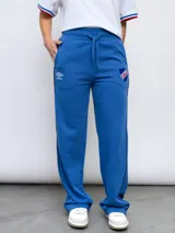 Pantalón de jogging azul con el escudo del Club Nacional de Football y el logo de Umbro.