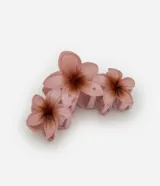 Pinza para el pelo color rosa con forma de tres flores de jasmim.