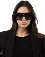 Lentes de sol negros estilo aviador con protección UV400 y polarizados.