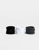 Set de gomitas de pelo elásticas de toalla en colores negro, blanco y gris.