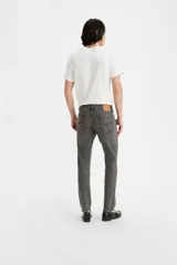 Pantalón de jean gris oscuro, corte skinny, tiro medio y confeccionado en tejido rígido.