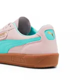 Championes Puma Palermo negros con detalles en blanco y suela color caramelo.