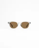 Anteojos de sol con lentes marrones polarizados y montura transparente.