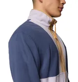 Chaqueta de forro polar Columbia Backbowl II Light FZ, color azul, blanco y beige, con cierre frontal, cuello alto, bolsillos laterales con cremallera y logo bordado en el pecho.