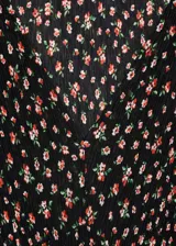 Vestido midi marrón con estampado de lunares blancos, escote en V, mangas cortas abullonadas y corte entallado.