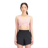 Top deportivo de color rosado, con tirantes delanteros y espalda en T de malla, diseñado para actividades de impacto medio.
