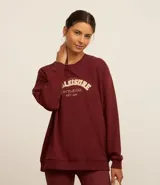 Buzo deportivo de algodón y poliéster color bordó, con cuello redondo, mangas largas y bordado "Athleisure" texturizado.