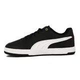 Championes Puma Caven 2.0 de cuero sintético negro con detalles en blanco, suela blanca y logo Puma dorado en el lateral.