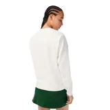 Buzo blanco de algodón con cuello redondo, puños y cintura acanalados. Estampado frontal con el logo de Lacoste y un cocodrilo vestido con ropa de ciclista andando en bicicleta.