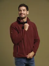 Sweater de micro fibra color azul con cierre parcial y detalles en cuero, de corte relajado y mangas largas.