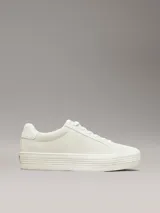 Zapatillas urbanas Calvin Klein color blanco hueso, de corte bajo y plataforma plana. Presentan logo CK bordado en el lateral y suela vulcanizada.