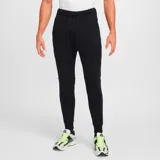 Pantalón largo de hombre Nike Tech Fleece, color negro, con cintura elástica ajustable con cordón, bolsillos laterales y corte ajustado.