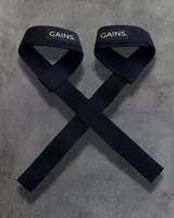 Straps de levantamiento de pesas color negro con logo "GAINS." en blanco.