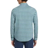Camisa de manga larga con patrón de cuadros pequeños en tonos azul y celeste. Confeccionada en chambray con stretch, de calce regular y puños con botón.