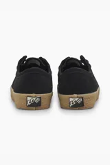 Zapatos negros de gamuza con cordones y suela de goma color caramelo.