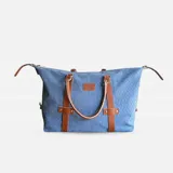Bolso de cuero natural color marrón, con gran capacidad, bolsillo interior con cierre y porta celular.