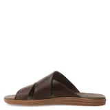 Sandalias de cuero color marrón habana, con tiras cruzadas y suela plana.