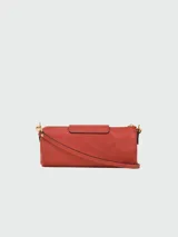 Bandolera Longchamp modelo Le Pliage Xtra, tamaño S, color terracota, con correa de cuero ajustable y cierre con botón a presión.
