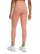 Calza deportiva color salmón, tiro alto, corte capri y bolsillo lateral.
