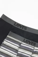 Pack de dos bóxer briefs Levi's, uno liso color negro y otro a rayas horizontales en tonos blanco, gris y lila. Ambos con cintura elástica gris con logo de la marca.