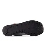 Championes New Balance 574 grises con detalles en blanco y celeste. Confeccionados en gamuza y tela, con logo "N" en los laterales y tecnología ENCAP en la entresuela.