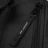 Bandolera Carhartt Work In Progress modelo Essentials Small, color marrón, con correa ajustable negra, bolsillo frontal con solapa y logo bordado.
