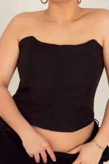 Corset largo de diseño básico, confeccionado en tejido Panamá con ballenas y cintas regulables en la espalda.