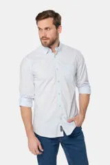Camisa azul marino de manga larga con bolsillo en el pecho, confeccionada en algodón.