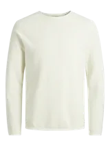 Sweater de punto color crudo, de manga larga y cuello redondo.