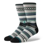 Medias Stance con diseño geométrico multicolor en tonos de gris, blanco, negro, azul y verde.