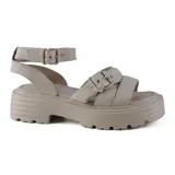 Sandalias de cuero color verde con plataforma y hebillas ajustables.