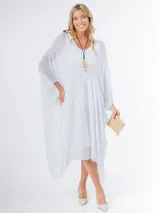 Vestido túnica blanco de seda italiana con frunce, calce oversized y talle único. Lleva forro elastizado al tono.