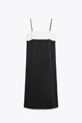 Vestido midi negro satinado con breteles finos y escote recto. Presenta un bloque superior en color blanco.