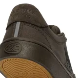 Championes de lona color marrón oscuro, con suela de goma y logo lateral.