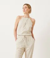 Blusa musculosa con cuello halter y estampado geométrico.