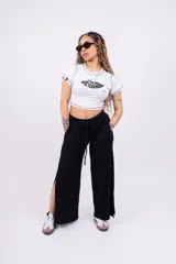 Pantalón palazzo negro de morley con lycra, corte amplio y cintura elastizada con cordón ajustable.