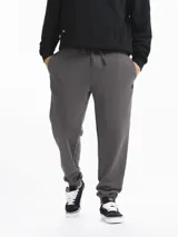 Pantalón de jogging de felpa color gris oscuro melange, con puños ajustados en los tobillos y cordón de ajuste en la cintura.