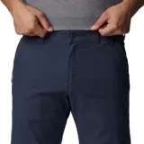 Pantalón negro de tela elástica utilitaria, con bolsillos para las manos y seguridad con cierre.