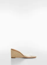 Zapato de mujer tipo cuña, con tira transparente en la parte superior y suela de yute.