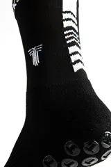 Medias largas de fútbol negras con logo blanco en la parte superior.