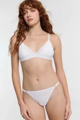 Colaless blanca de microtul con tela flock y ajustes laterales.