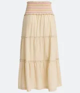 Conjunto de top corto con breteles finos y pollera midi de algodón color crema con cintura elastizada y volados en el ruedo.