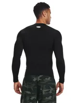 Remera de compresión Under Armour HeatGear de manga larga, color negro con logo blanco en el pecho.