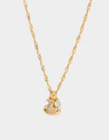 Cadena corta dorada con dije de corazón, inicial con strass y cristal.