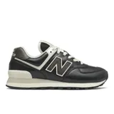 Championes New Balance modelo WL574PL2, color negro con detalles en blanco hueso y gris oscuro texturizado. Presentan el logo "N" en el lateral y entresuela ENCAP.