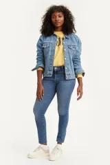 Jeans de tiro alto color azul medio, corte skinny.