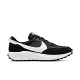 Championes Nike Waffle Debut negros con detalles en blanco y naranja.
