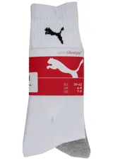 Pack de tres pares de medias Puma blancas con talón gris y logo negro.
