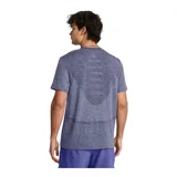 Remera deportiva gris jaspeado de corte clásico, con cuello redondo y mangas cortas. Confeccionada con tejido de punto transpirable y tecnología seamless para mayor comodidad.