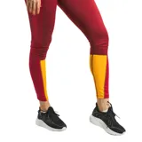 Calza deportiva Topper Cuts II, color bordó con paneles laterales en amarillo.